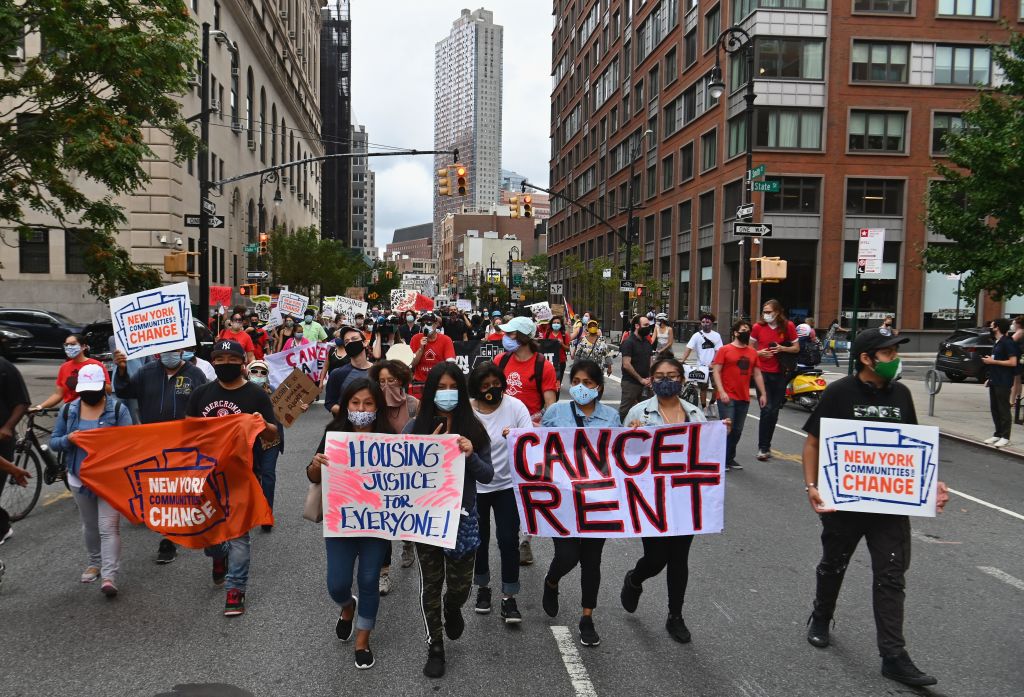 People march to demand rent cancellation.
