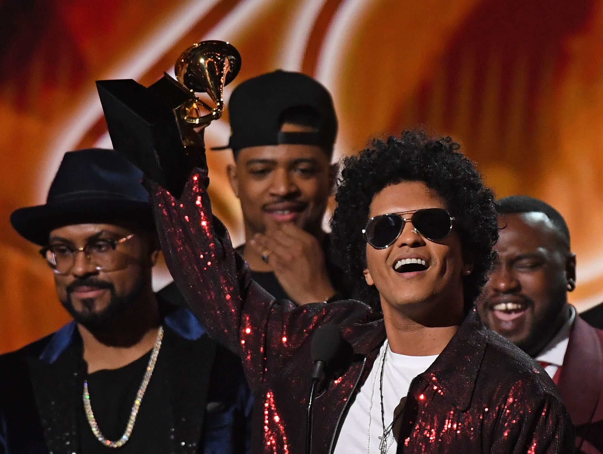 Bruno Mars accepts a Grammy