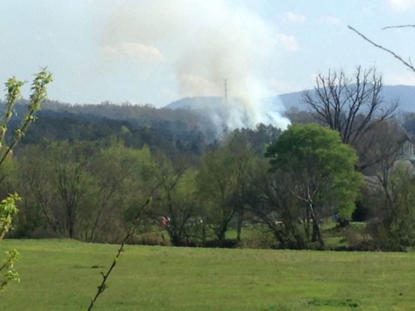 Smoke rises from a helicopter crash in Tennessee.