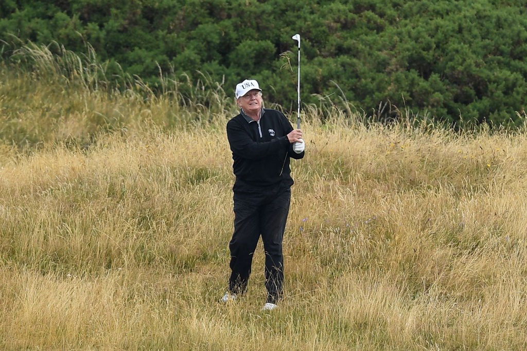 President Trump golfs on his course in Scotland