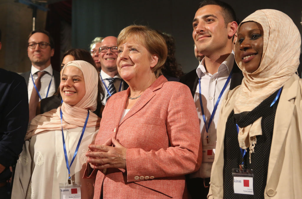 German Chancellor Angela Merkel with refugee college students