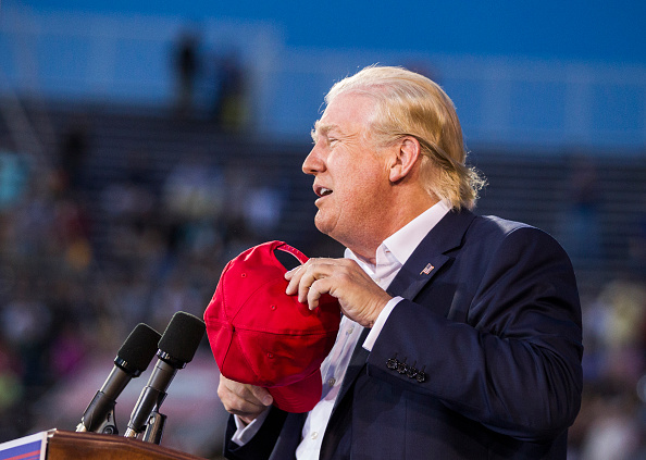 Donald Trump, with his hat in his hands.