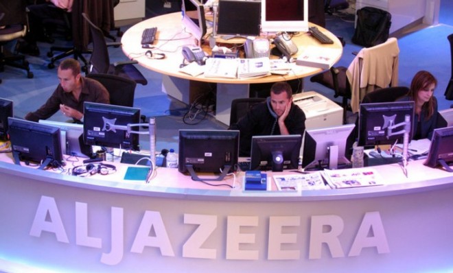 Al Jazeera English Channel staff prepare for a broadcast in the Doha news room in Qatar in 2006. 