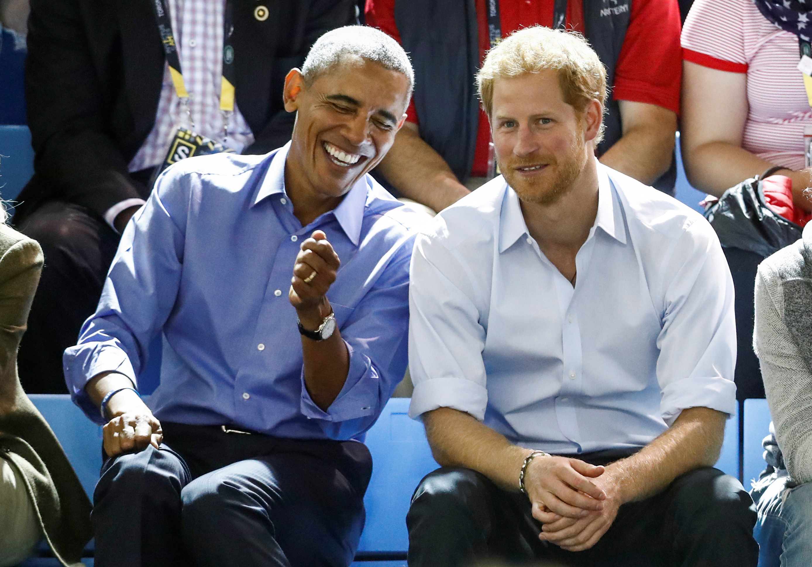 Prince Harry and former President Obama laugh together