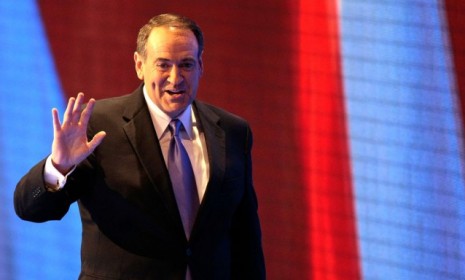 Republican (and Fox TV host) Mike Huckabee said potential overexposure and the cost of a long campaign are two reasons to hold off on entering the race.