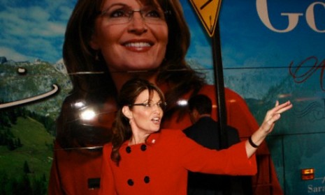 Sarah Palin in front of her tour bus.