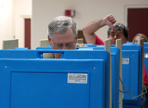 Sen. Mitch McConnell is photobombed in the most unfortunate way as he casts his ballot
