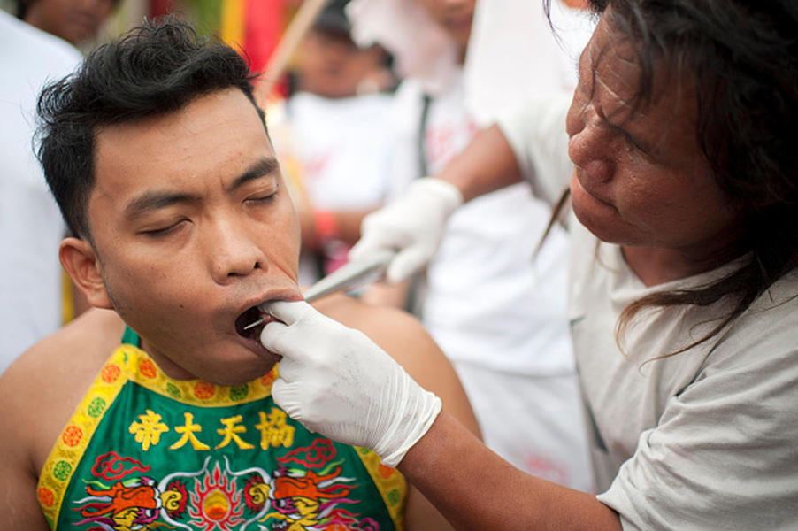 Vegetarian festival takes body piercings to the extreme