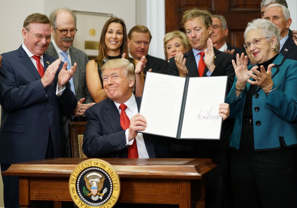 President Trump displays executive healthcare order.