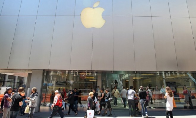 Pedestrians walk past an Apple Store in San Francisco.