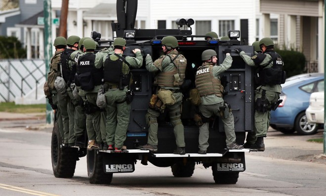 A police tactical unit drives through the streets of Watertown, Mass as they search for bombing suspect Dzhokhar Tsarnaev on April 19.