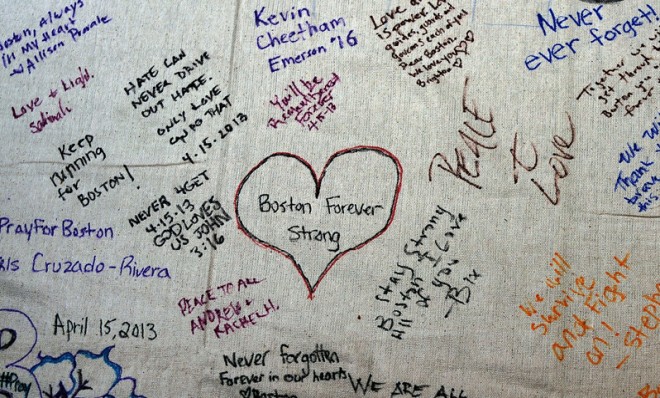 A memorial canvas hangs at the Boston Commons during a vigil for victims of the Boston Marathon bombings, April 16.