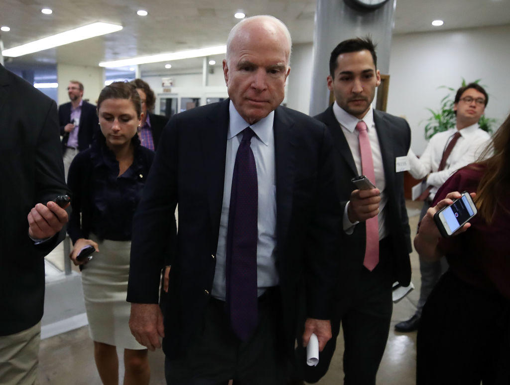 Sen. John McCain (R-Ariz.) with reporters