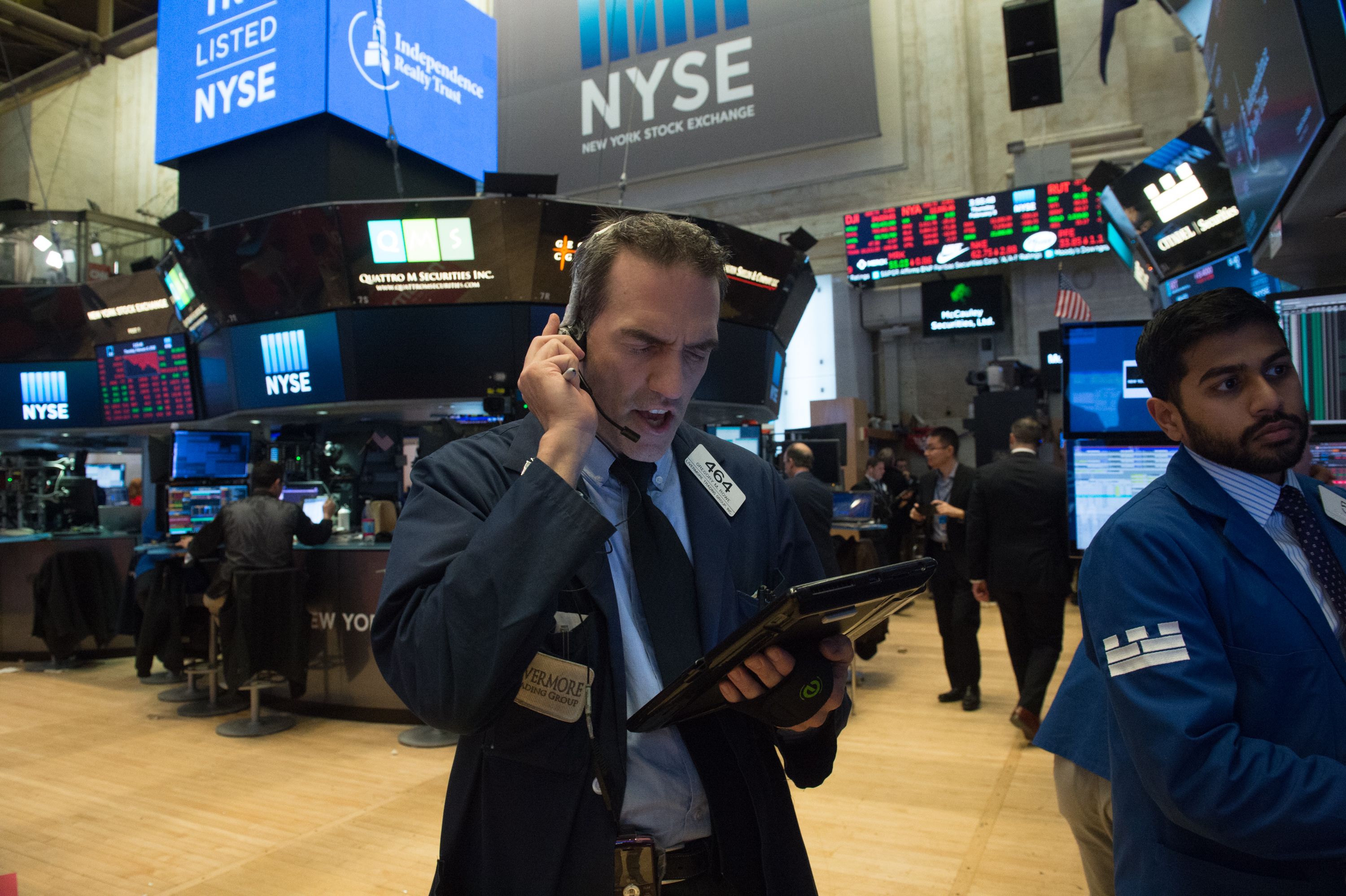 Traders scramble on the New York Stock Exchange floor