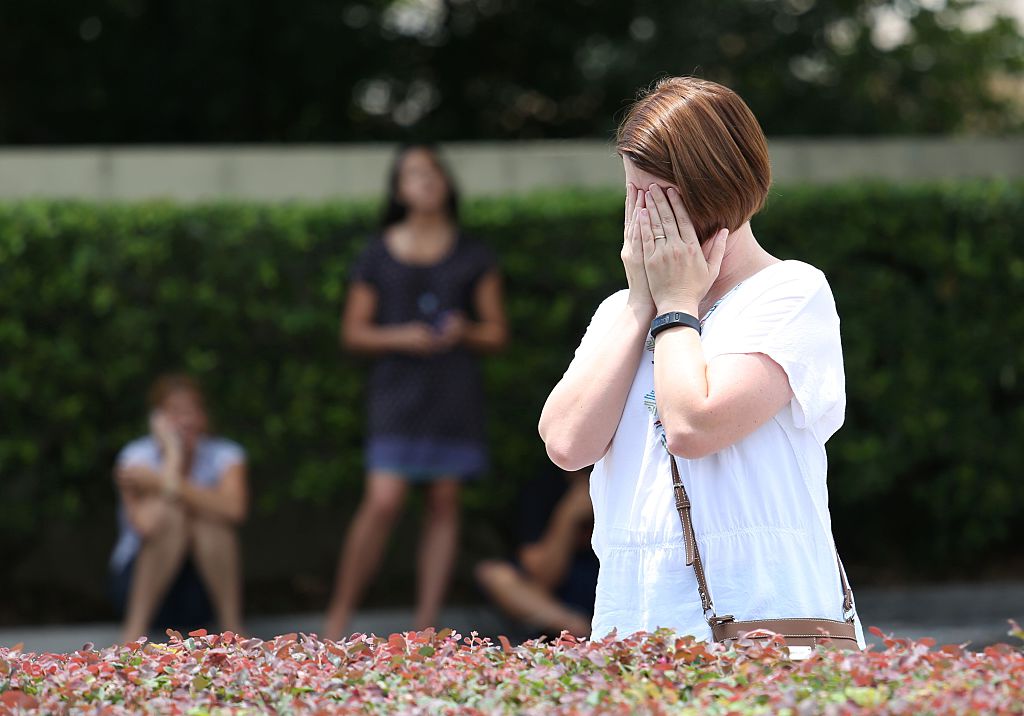 A woman mourns the victims of the Orlando nightclub shooting