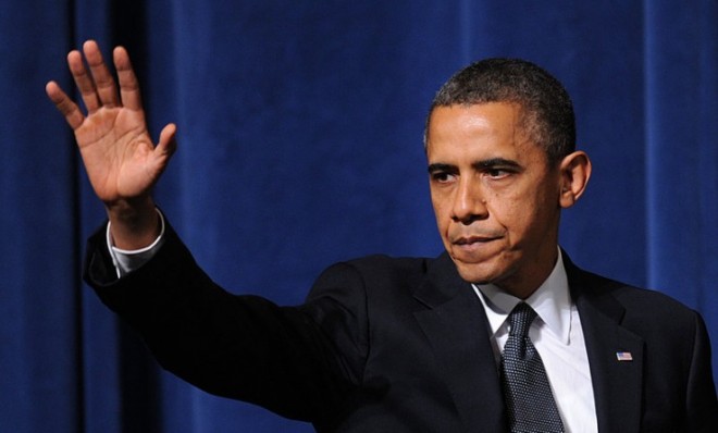 President Obama waves after speaking at an interfaith vigil in Newtown, Conn., on Dec. 16.