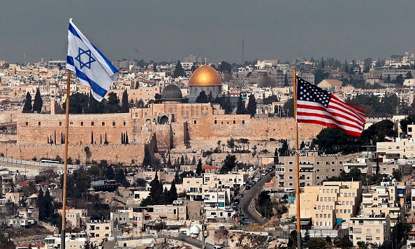 Israeli and American flags fly in East Jerusalem.
