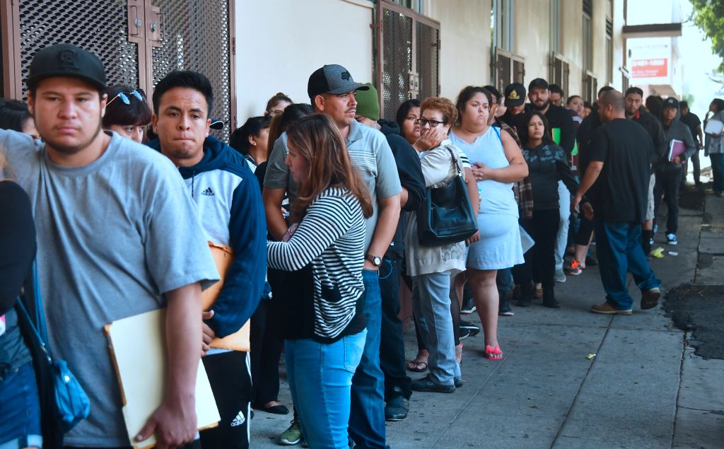 DACA recipients wait in line in Los Angeles to renew their work permits before the deadline.