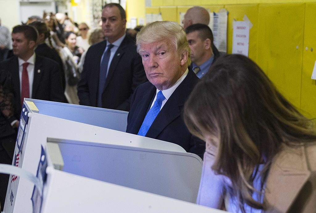 Donald Trump could not resist peeking over at his wife&#039;s ballot. 