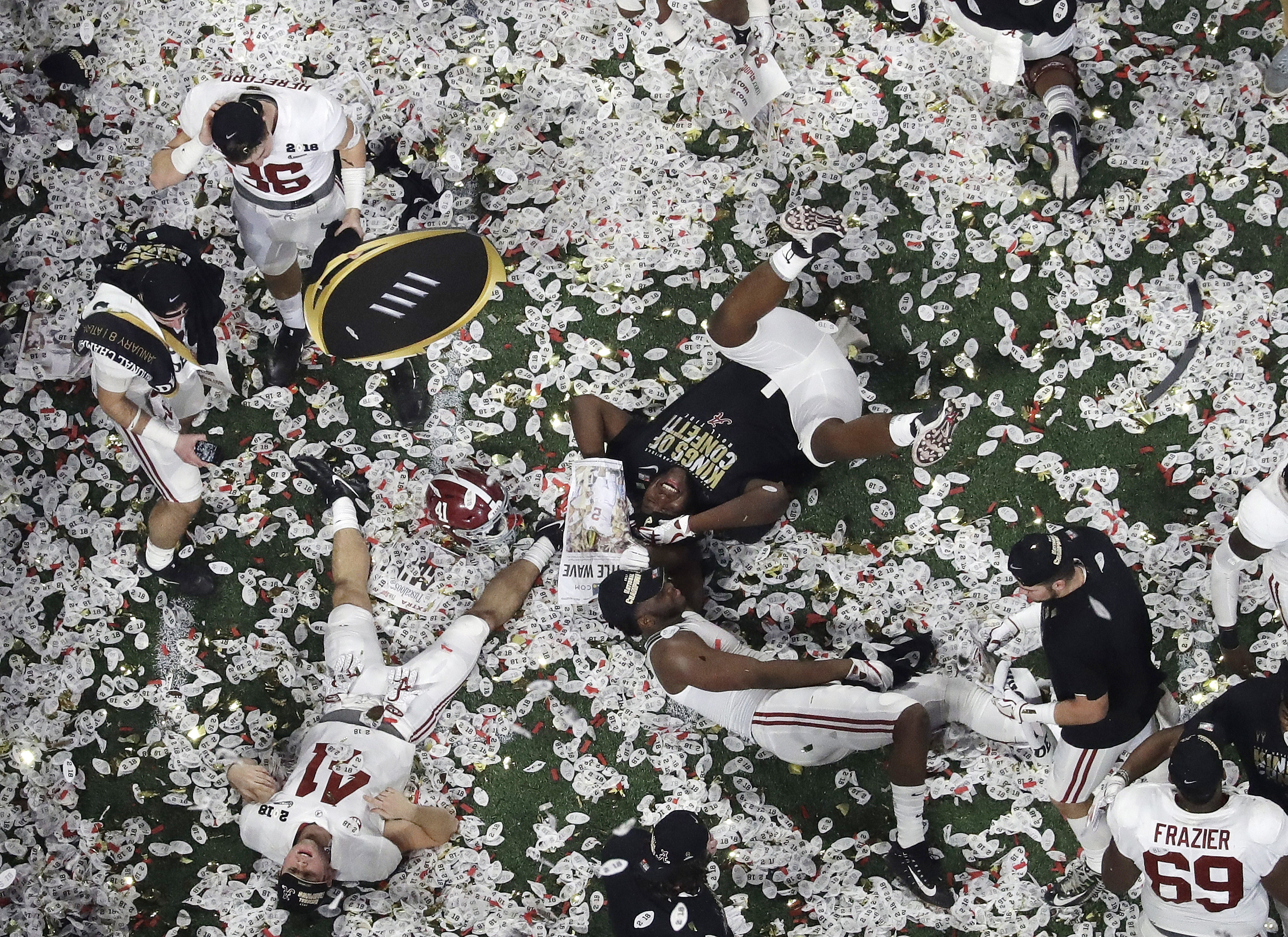Alabama players celebrate winning the NCAA college football playoff championship game.