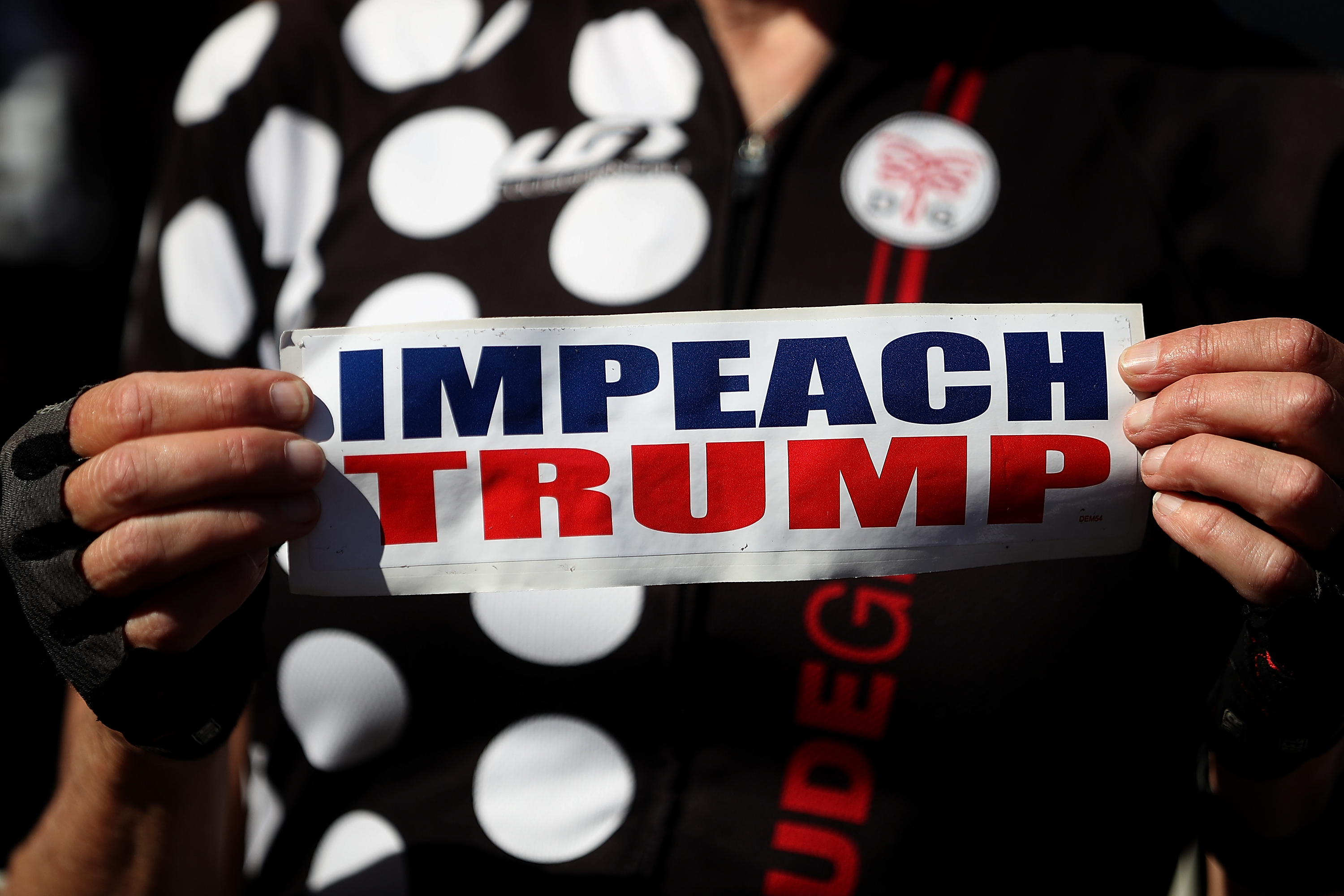 A sign calling for impeachment