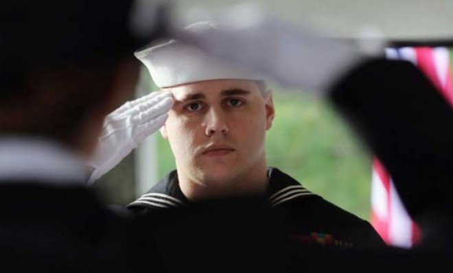 A U.S. Navy honor guard salutes