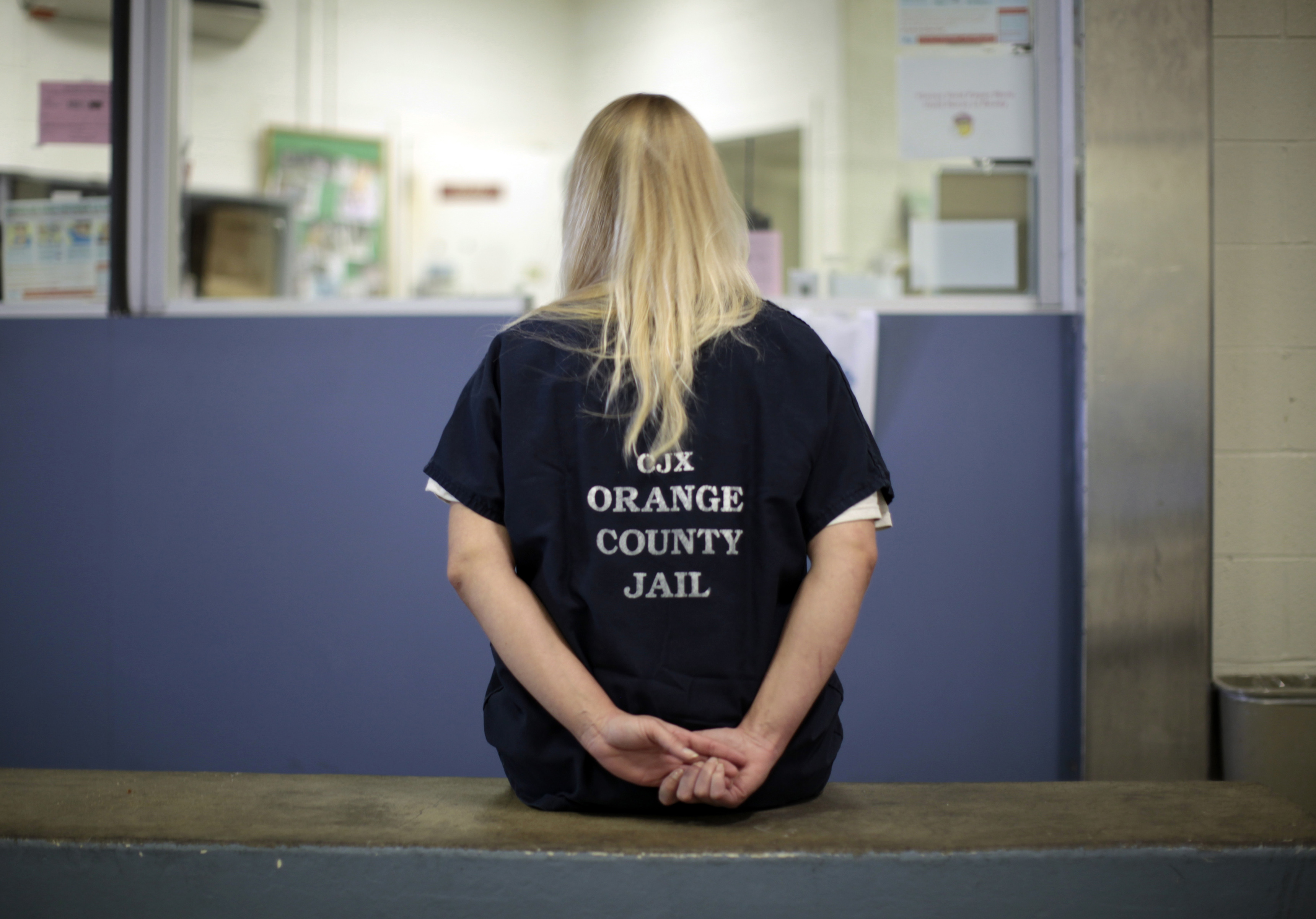 A female inmate is checked into the Orange County jail in Santa Ana, California.