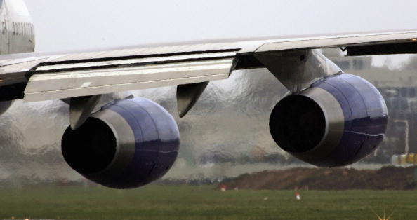 An airplane&#039;s engines emit exhaust