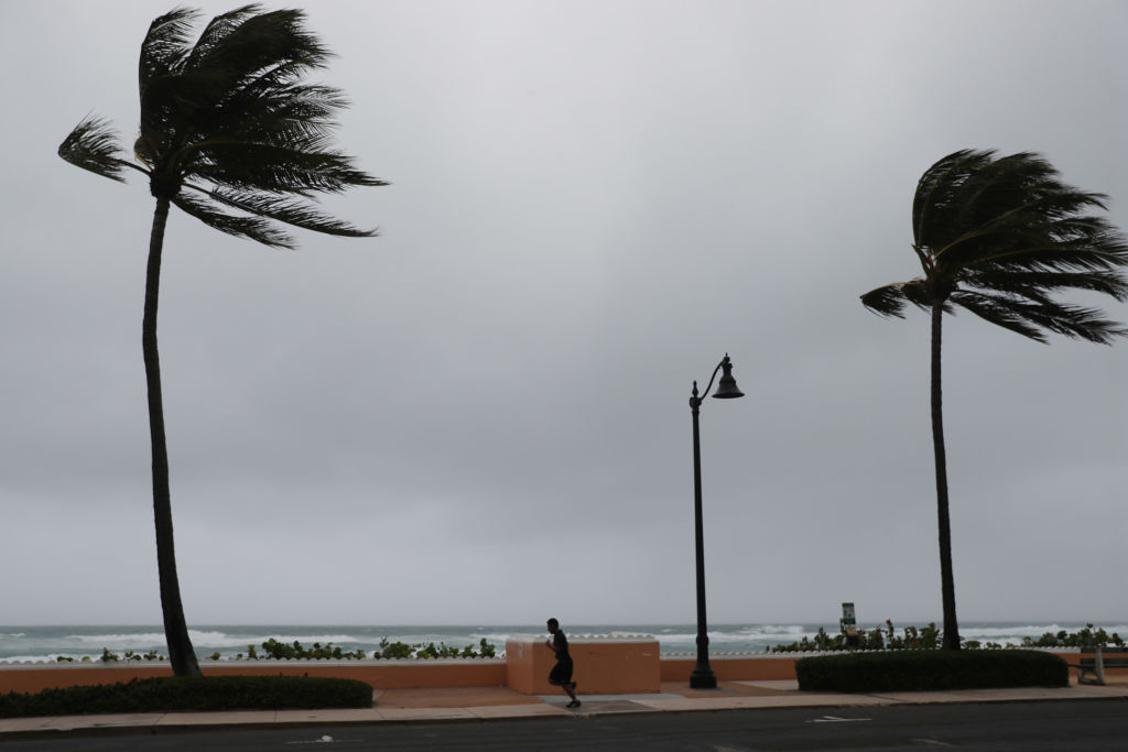 A runner is seen as Tropical Storm Isaias passes through the area on August 02, 2020 in Deerfield Beach, Florida.