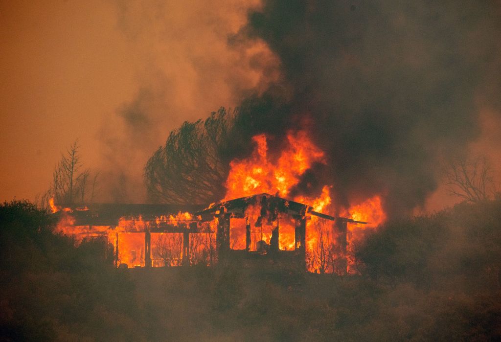 A house burns down near Finley, California.