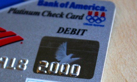 Debit card users will get a break from transaction fees, thanks to the financial reform law, but they will also have to say goodbye to those airmile rewards.