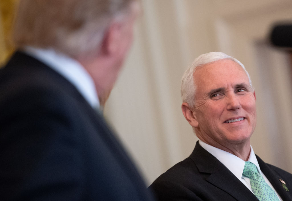Mike Pence smiles at President Trump