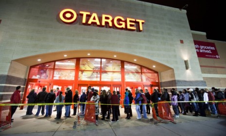 Bargain hunters outside a Virginia Target last year: Target stores are planning to push Black Friday openings to midnight, potentially forcing employees to cut their Thanksgiving dinners shor