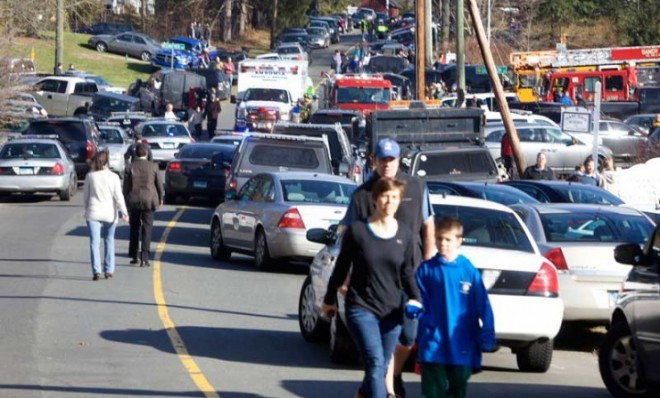 Parents pick up their children near Sandy Hook Elementary School in Newtown, Conn., after Friday&#039;s deadly shooting.