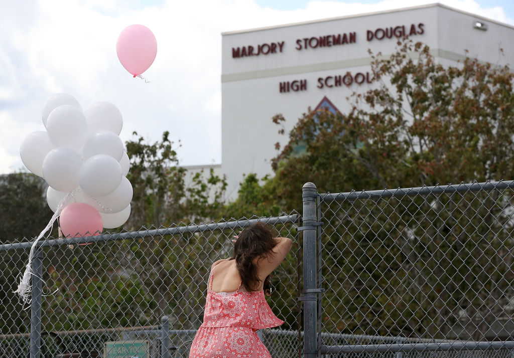 A girl cries outside Marjory Stoneman Douglas High School.
