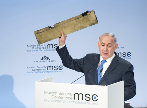  Israeli Prime Minister Benjamin Netanyahu, holds a part of a downed drone during his speech at the Munich Security Conference, MSC, in Munich , Germany, Sunday, Feb. 18, 2018. 