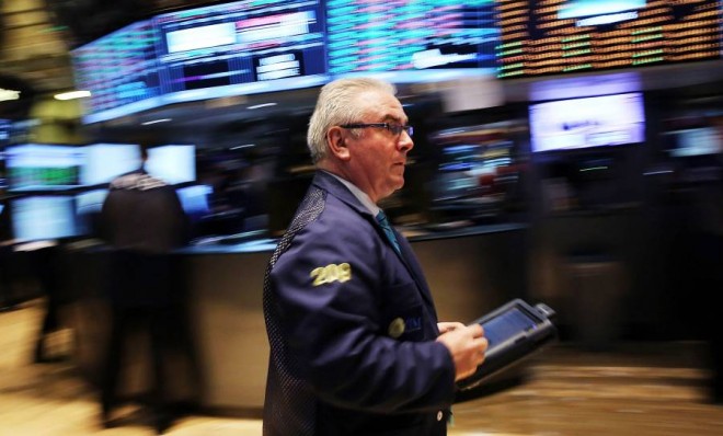 A trader works on the floor of the New York Stock Exchange at the end of the trading day on August . The Dow Jones industrial average and S&amp;P 500 rallied to new highs on Thursday.