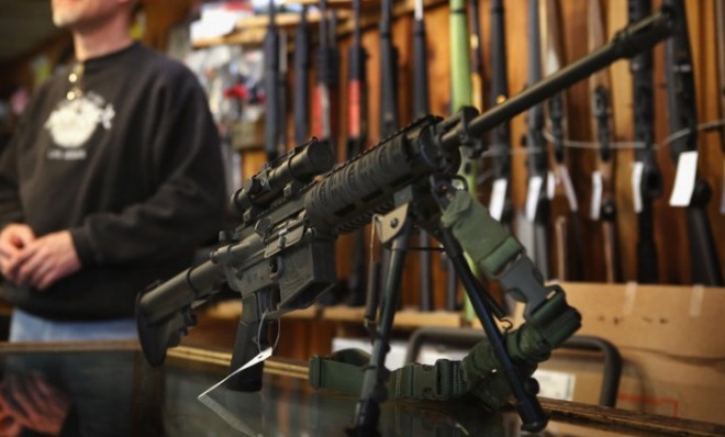 An AR-15 style rifle sits on display at Freddie Bear Sports store in Tinley Park, Ill.