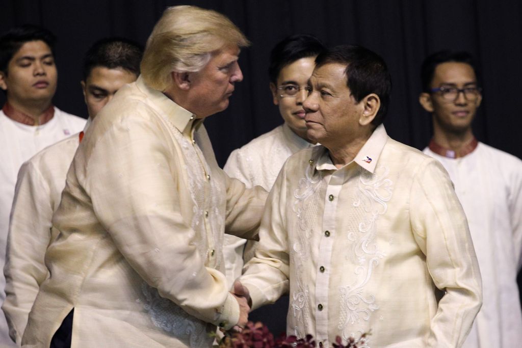 President Donald Trump shakes hands with Philippines President Rodrigo Duterte 