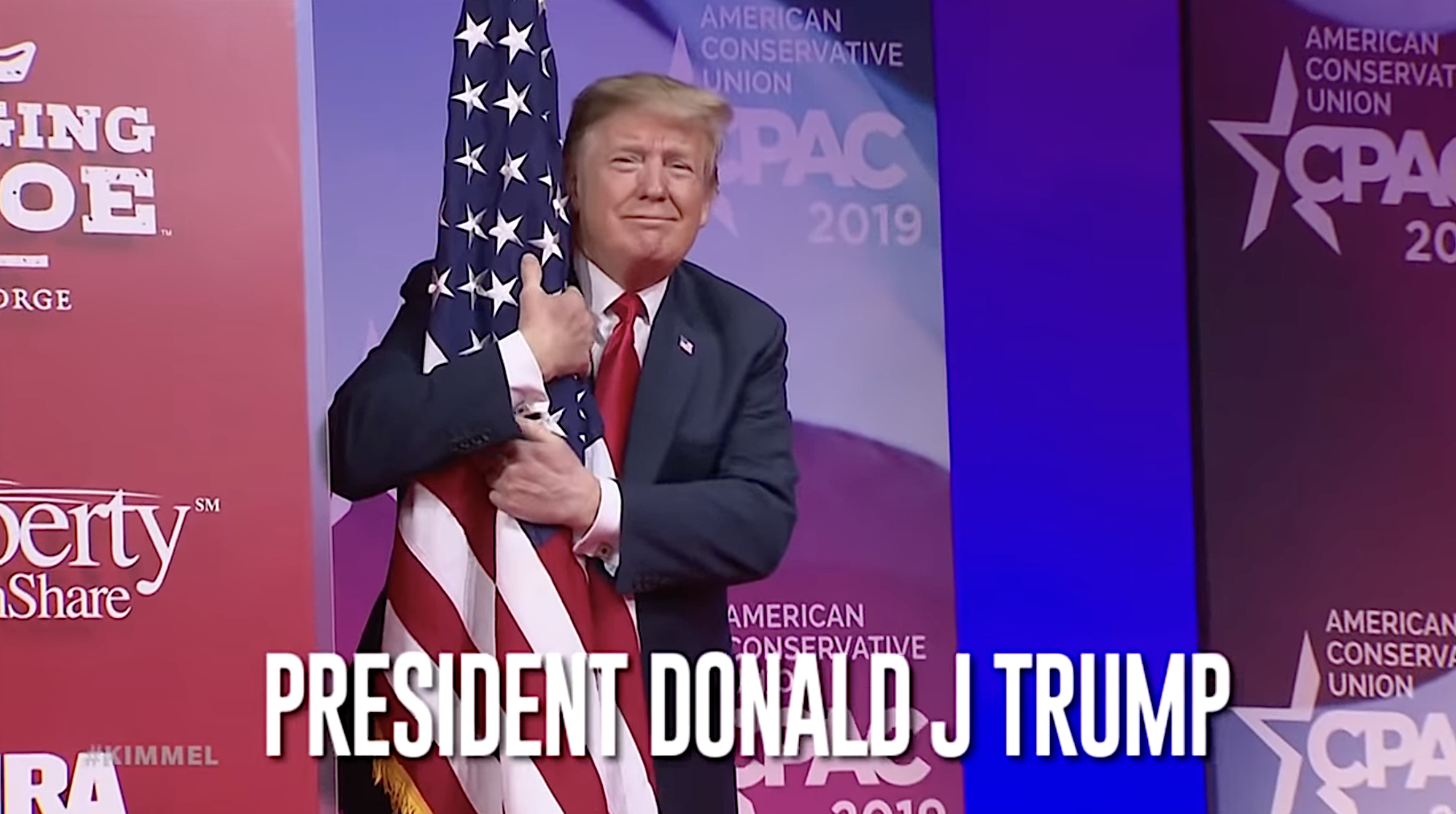 Trump hugs a flag