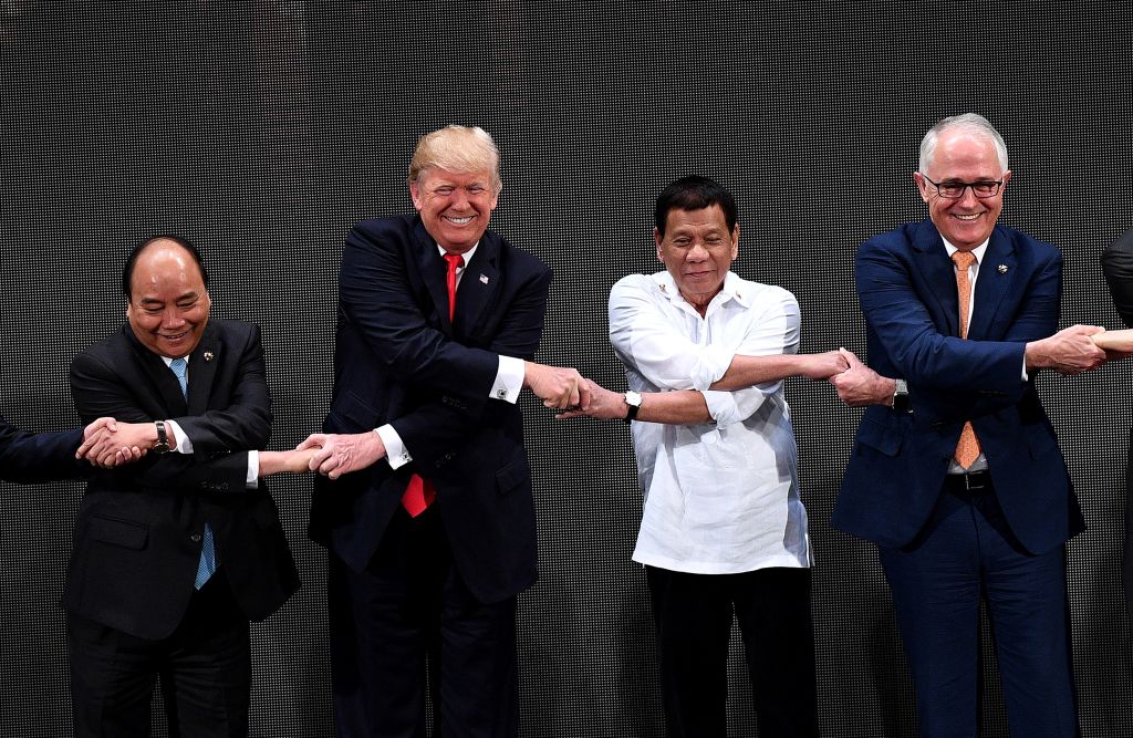 President Trump shakes hands with world leaders