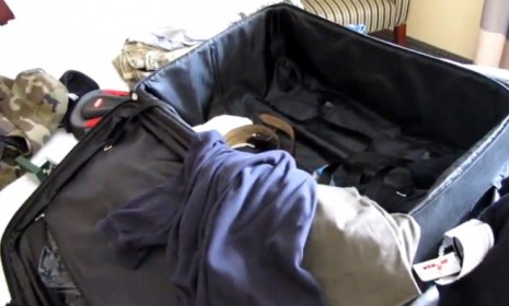 The contents of Sy Haze&#039;s luggage are laid out on his hotel bed in a video that shows off his pee-soaked clothes.
