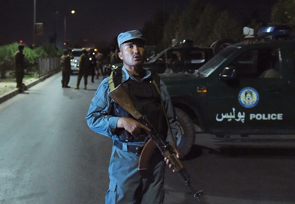 An Afghan police officer outside the American University of Afghanistan in Kabul.