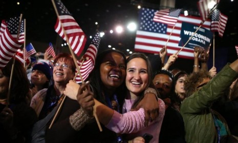 Young Obama supporters in Chicago cheer after networks project the president&#039;s re-election.