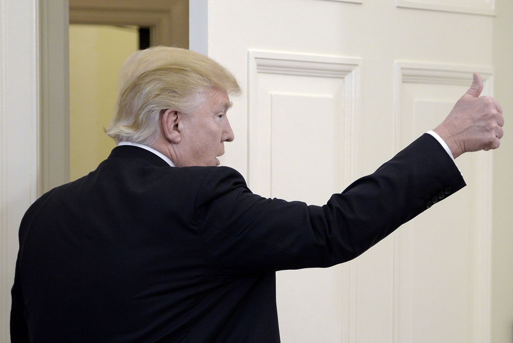President Trump gives a thumbs-up.