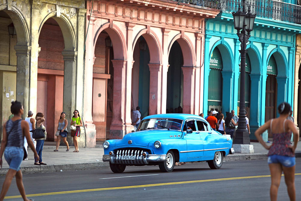 A circa-1950 Buick cruises downtown Havana.
