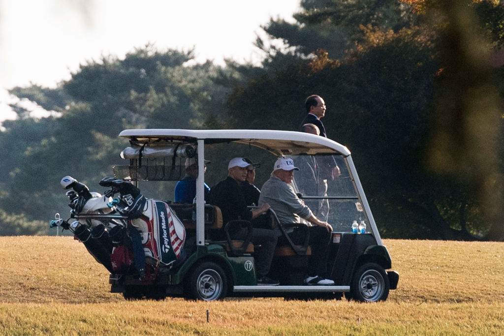 President Trump and Japanese Prime Minister Shinzo Abe golfing in Japan