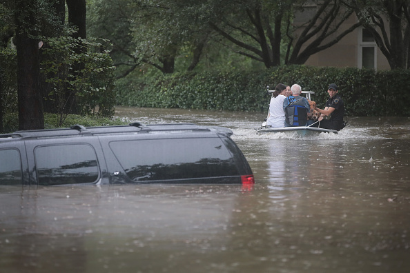 Houston residents being rescued in floodwaters.