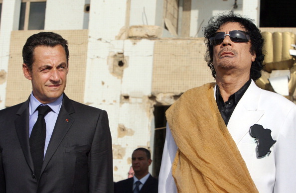 Nicolas Sarkozy and Muammar Gaddafi.