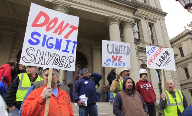 Union workers protest outside the Capitol in Lansing, Mich., on Dec. 6.